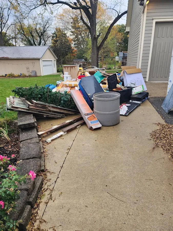 Dumpster being loaded with debris for Residential Dumpster Rental in Rome